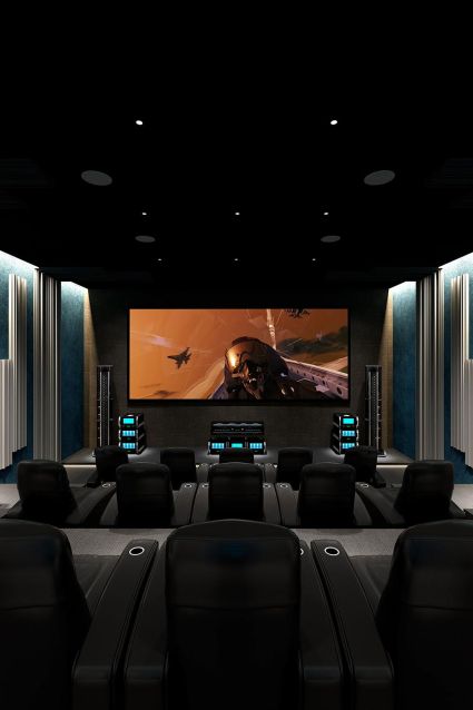 A luxurious home theater featuring black leather recliners facing a large screen showing an action scene, with modern lighting and acoustic treatments on the walls.