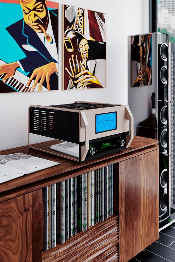 McIntosh amp and speaker on top of a walnut wood credenza with colorful artwork