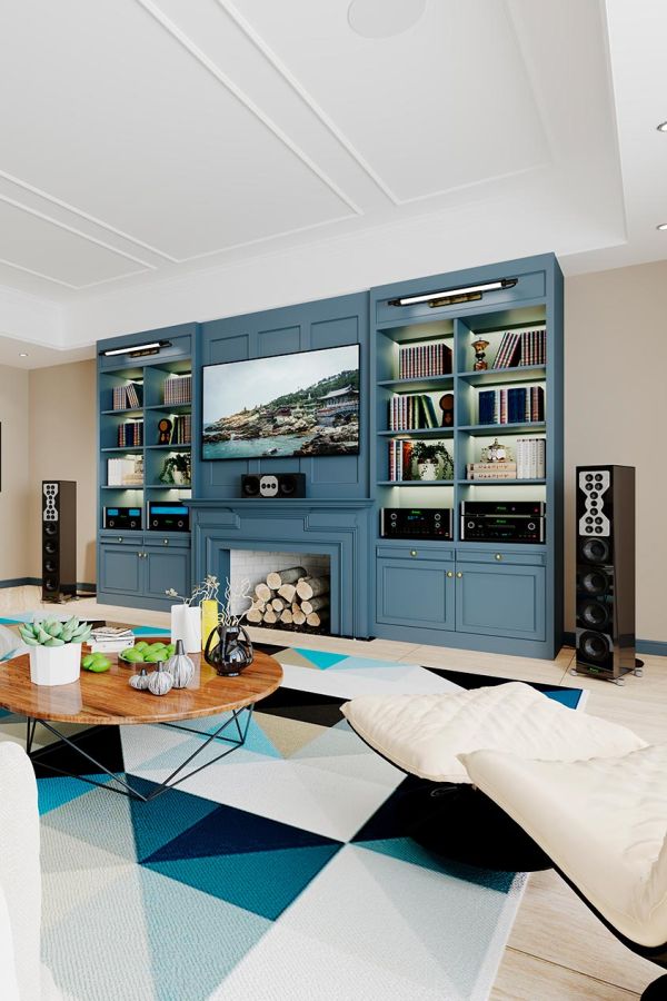 A spacious, open-concept kitchen and living area with modern light fixtures, large glass doors, and a dining table in the foreground.